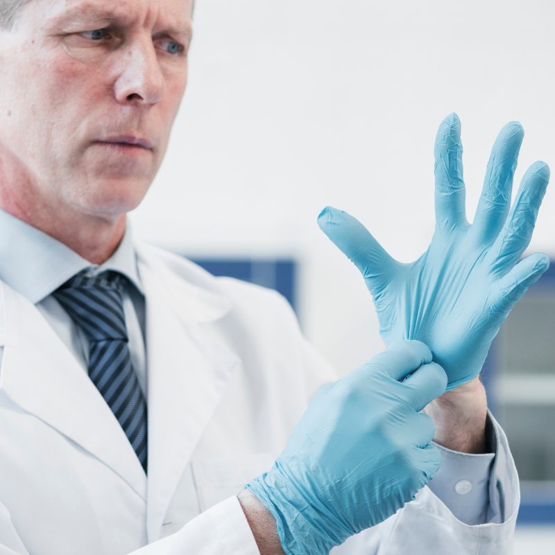 man with surgical gloves