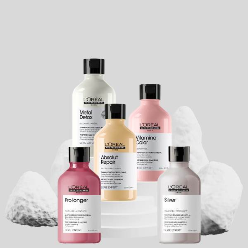 Produits capillaires L'Oréal Professionnel sur fond gris.